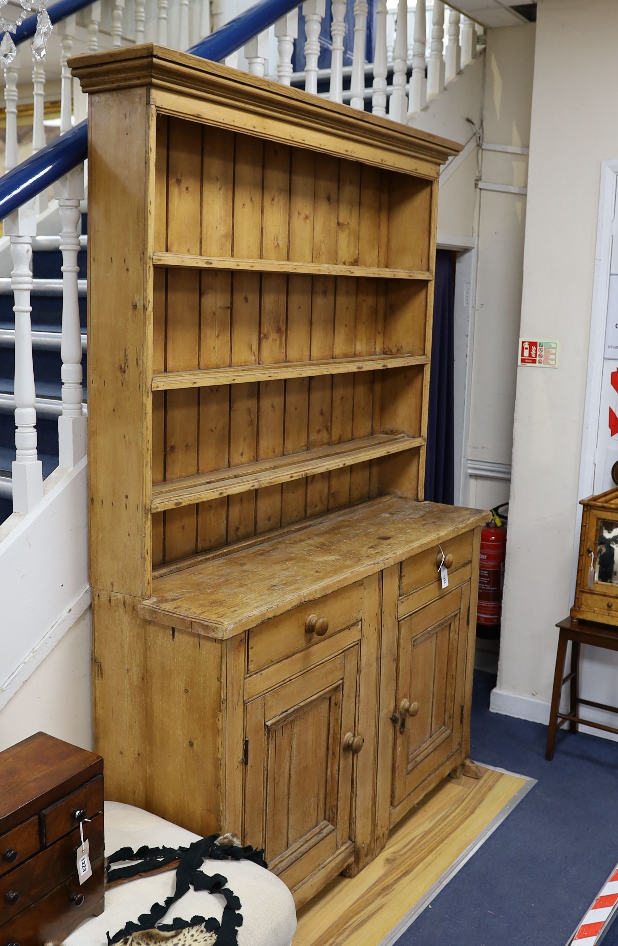An early 19th century pine dresser, length 142cm, depth 43cm, height 208cm